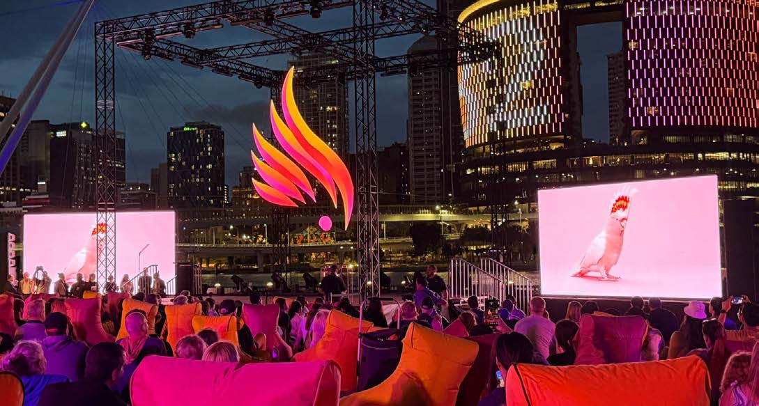 Brisbane 2032 emblem illuminated above the audience at its South Bank reveal.